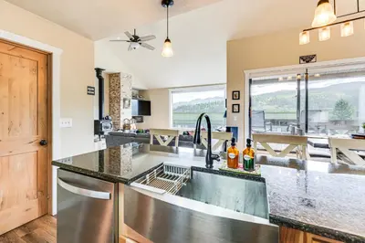 a kitchen with a sink and a large window at 2 Mi to Winter Park Slopes Mtn-View Condo! in Winter Park