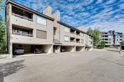 an empty parking lot in front of a building at 2 Mi to Winter Park Slopes Mtn-View Condo! in Winter Park