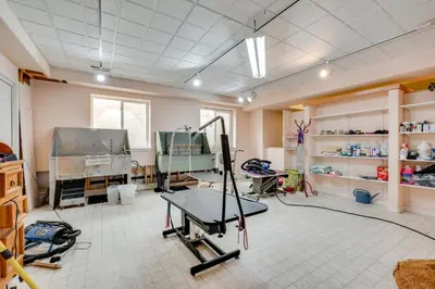 a room with a gym with a table in it at Pet-Friendly Longmont Home with McIntosh Lake Access in Longmont