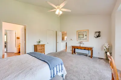 a bedroom with a bed and a ceiling fan at Pet-Friendly Longmont Home with McIntosh Lake Access in Longmont