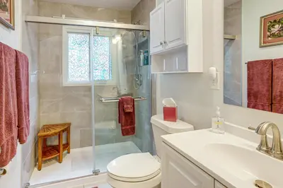 a bathroom with a shower and a toilet and a sink at Modern Wheat Ridge Home about 5 Mi to Dtwn Denver in Wheat Ridge