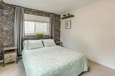 a bedroom with a bed and a window at Modern Wheat Ridge Home about 5 Mi to Dtwn Denver in Wheat Ridge