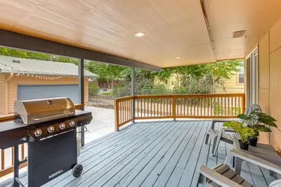 a screened porch with a grill on a deck at Modern Wheat Ridge Home about 5 Mi to Dtwn Denver in Wheat Ridge