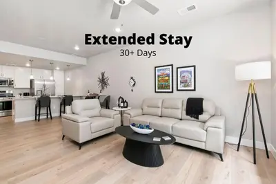 an extended stay days apartment living room and kitchen at Northfield Old Town Flat with Attached Garage and EV in Fort Collins