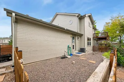 a house with a fence in front of it at Shady Grove with 4 King Beds, Dog Run and Outdoor Fun in Loveland