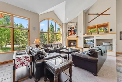 a living room with leather furniture and a fireplace at Modern Mountain Stay Hot Tub Fire Pit and Views in Silverthorne