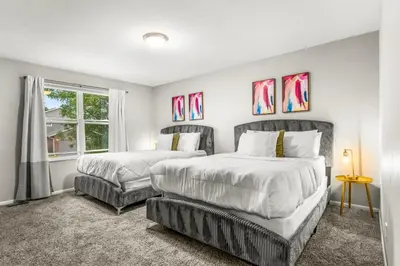 a bedroom with two beds and a window at Modern 4BR Family Friendly Retreat with Hot tub in Arvada