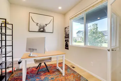 a home office with a desk and a window at Less Than 2 Mi to Gaylord Rockies Remote-Work Hub with Gym! in Aurora