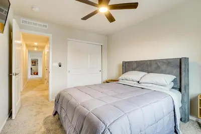 a bedroom with a bed and a ceiling fan at Less Than 2 Mi to Gaylord Rockies Remote-Work Hub with Gym! in Aurora