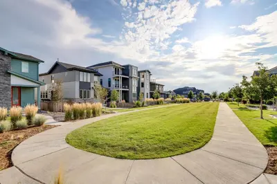 a walkway in a neighborhood with houses at Less Than 2 Mi to Gaylord Rockies Remote-Work Hub with Gym! in Aurora