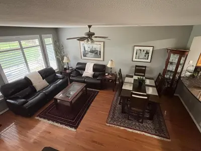 a living room with a couch and a table at Unwind in Style in this stunning townhome retreat in Superior