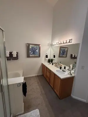 a bathroom with a sink and a mirror at Unwind in Style in this stunning townhome retreat in Superior