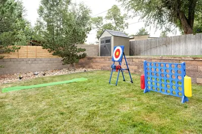 a yard with a target sign and a obstacle course at Stylish House with Hot Tub, Fire Pit Pool table near Denver in Arvada