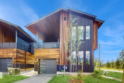 a house with a wooden facade at Moose Mountain Lodge in Fraser