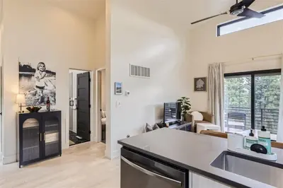 a kitchen and living room with a counter top at Pinebox at Evergreen Modern 20Acres -Serene-Creek in Evergreen