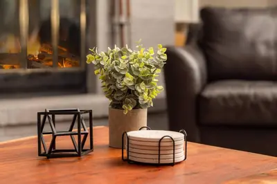 a table with a vase with a plant on it at Bright & Spacious Mtn Retreat in Fraser