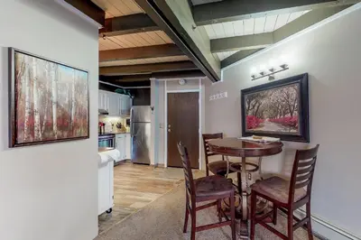 a dining room with a table and chairs at Lodge Pole Condo in Silverthorne