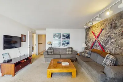 a living room with a couch and a table at Lake Cliffe 209F in Dillon