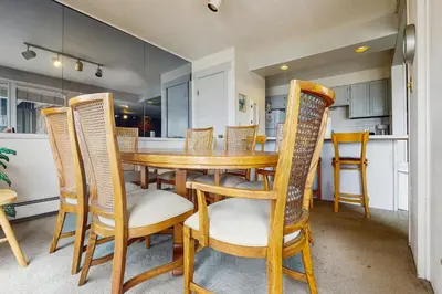 a dining room with a wooden table and chairs at Lake Cliffe 209F in Dillon