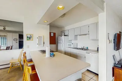 a kitchen with white cabinets and a counter top at Lake Cliffe 209F in Dillon