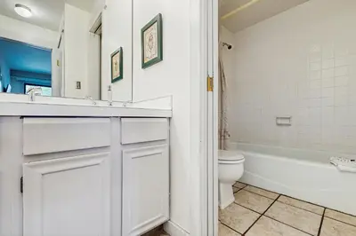 a bathroom with a sink and a toilet and a tub at Lake Cliffe 209F in Dillon