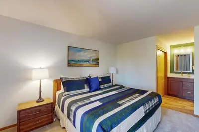 a bedroom with a large bed and a bathroom at Marina Place 137 in Dillon