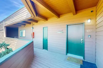 a house with a green door on a porch at Marina Place 137 in Dillon
