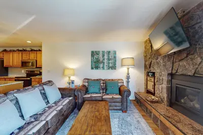 a living room with two couches and a fireplace at Marina Place 137 in Dillon