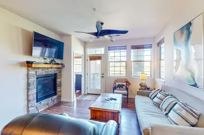 a living room with a couch and a fireplace at Granby Ranch H103 in Granby