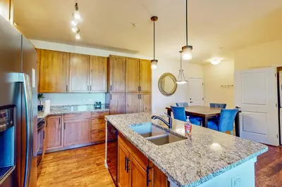 a kitchen with wooden cabinets and a counter top at Granby Ranch H103 in Granby