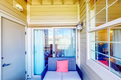 a pink pillow sitting on a porch with a window at Granby Ranch H103 in Granby