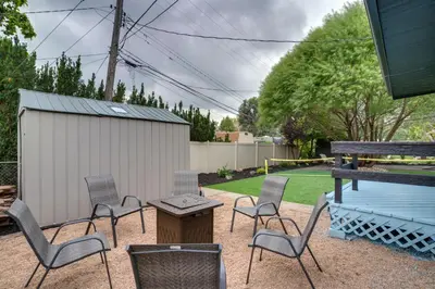 a patio with chairs and a table and a grill at Game Room and Fire Pit Family-Friendly Loveland Gem in Loveland