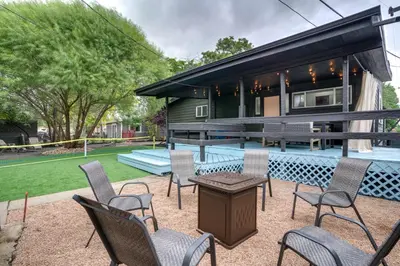 a group of chairs and a table in front of a house at Game Room and Fire Pit Family-Friendly Loveland Gem in Loveland