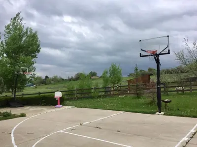 a basketball hoop with a basket on a court at New! Cozy north Boulder guesthouse! in Boulder