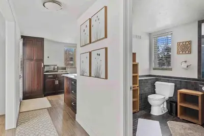 a bathroom with a toilet and a sink at New! Cozy north Boulder guesthouse! in Boulder
