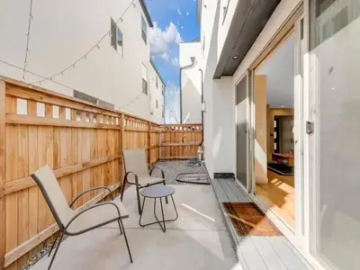 a balcony with chairs and a table at Modern Townhome for long stays Near Sloans Lake in Denver
