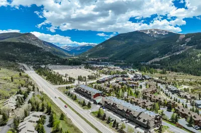 an aerial view of a resort in the mountains with a train at Gateway Studio - Pool, Hot Tub, Walk to Slopes in Keystone