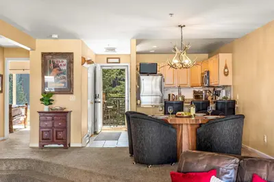 a kitchen with a table and chairs in a room at 2 Bedroom Hot Tub Fireplace Walk to Lake Dillon in Frisco