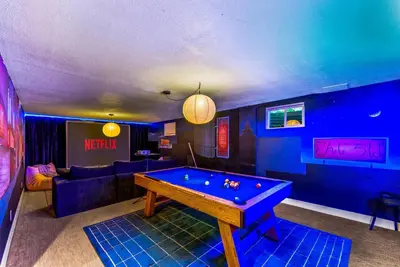 a living room with a pool table in it at 5BD Japanese-Themed w/ Hot Tub, Movie Room & Games in Arvada