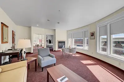 a living room with a couch and a table and chairs at Century Casino & Hotel - Central City in Central City