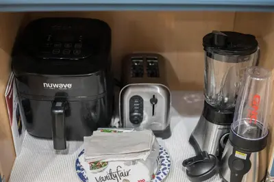 a counter top with a blender and other kitchen items at Luxury Spacious House Great for a Family Retreat in Loveland