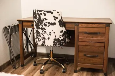 a computer desk with a black and white chair at Luxury Spacious House Great for a Family Retreat in Loveland