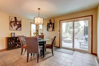 a dining room with a table and chairs and a window at 3BR Paws & Relax by Sweetheart Stays in Loveland