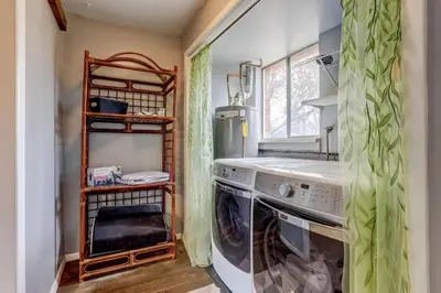 a laundry room with a washing machine and a window at 3BR Paws & Relax by Sweetheart Stays in Loveland