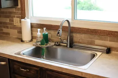 a kitchen sink with two bottles on it at 3BR Paws & Relax by Sweetheart Stays in Loveland
