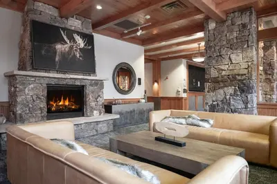 a living room with couches and a fireplace at Ski-In Ski-Out Zephyr 1 Bedroom Condo 2204 in Winter Park
