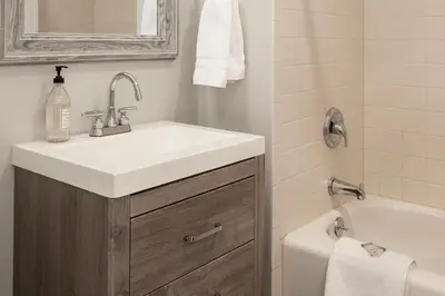 a bathroom with a sink and a toilet and a tub at Ski-In Ski-Out Zephyr 1 Bedroom Condo 2204 in Winter Park