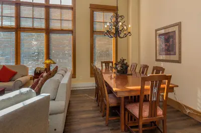 a dining room with a table and a couch at Lone Eagle 3052 in Keystone