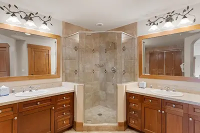 a bathroom with two sinks and a shower at Lone Eagle 3052 in Keystone