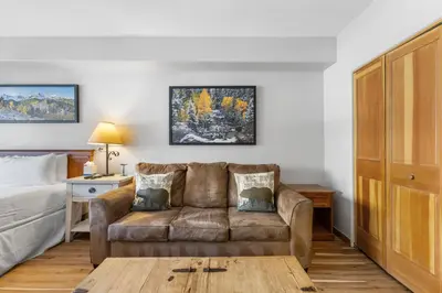 a living room with a couch and a bed at Gateway 5028 in Keystone